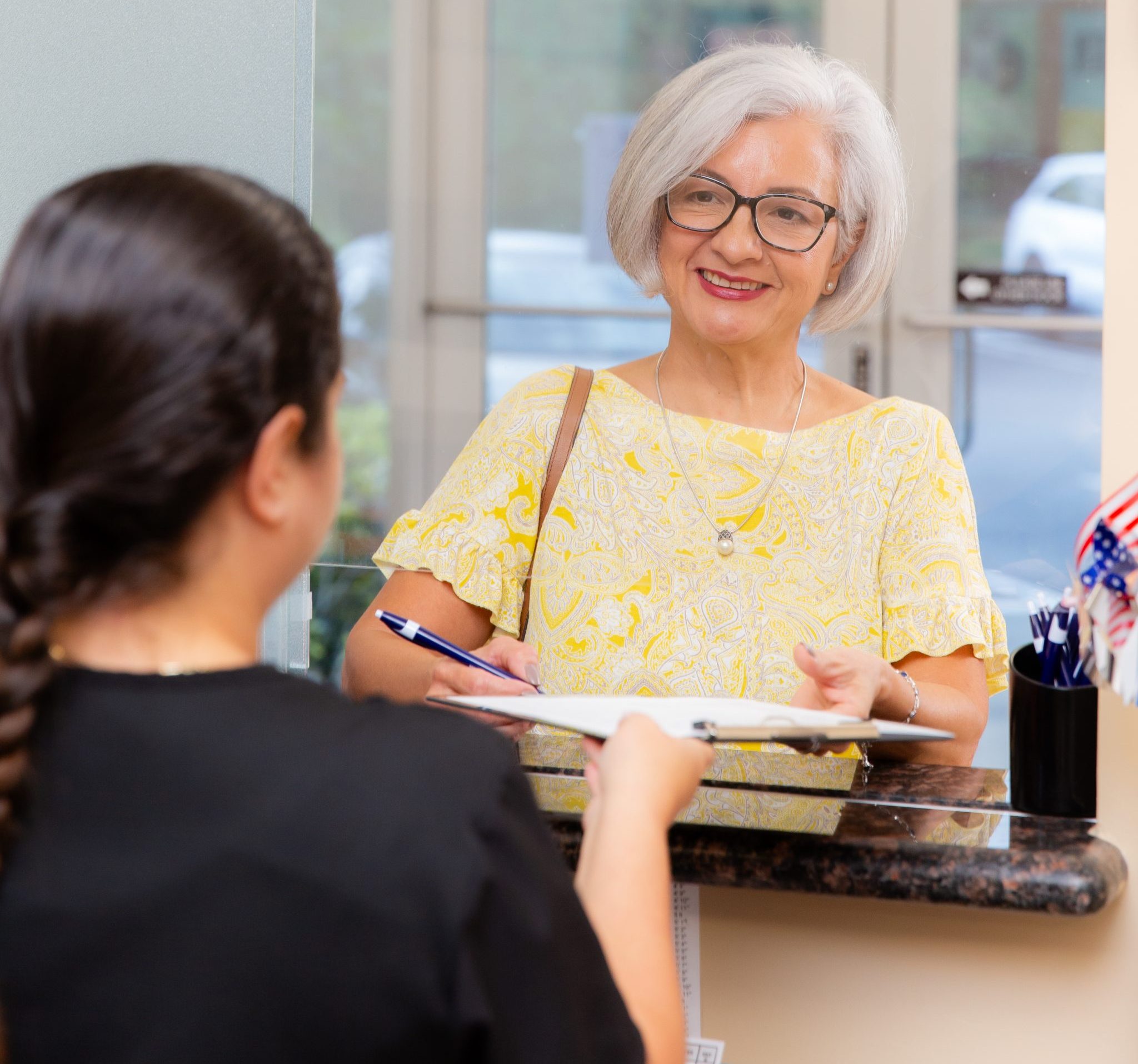 Patient signing in to participate in a research study.